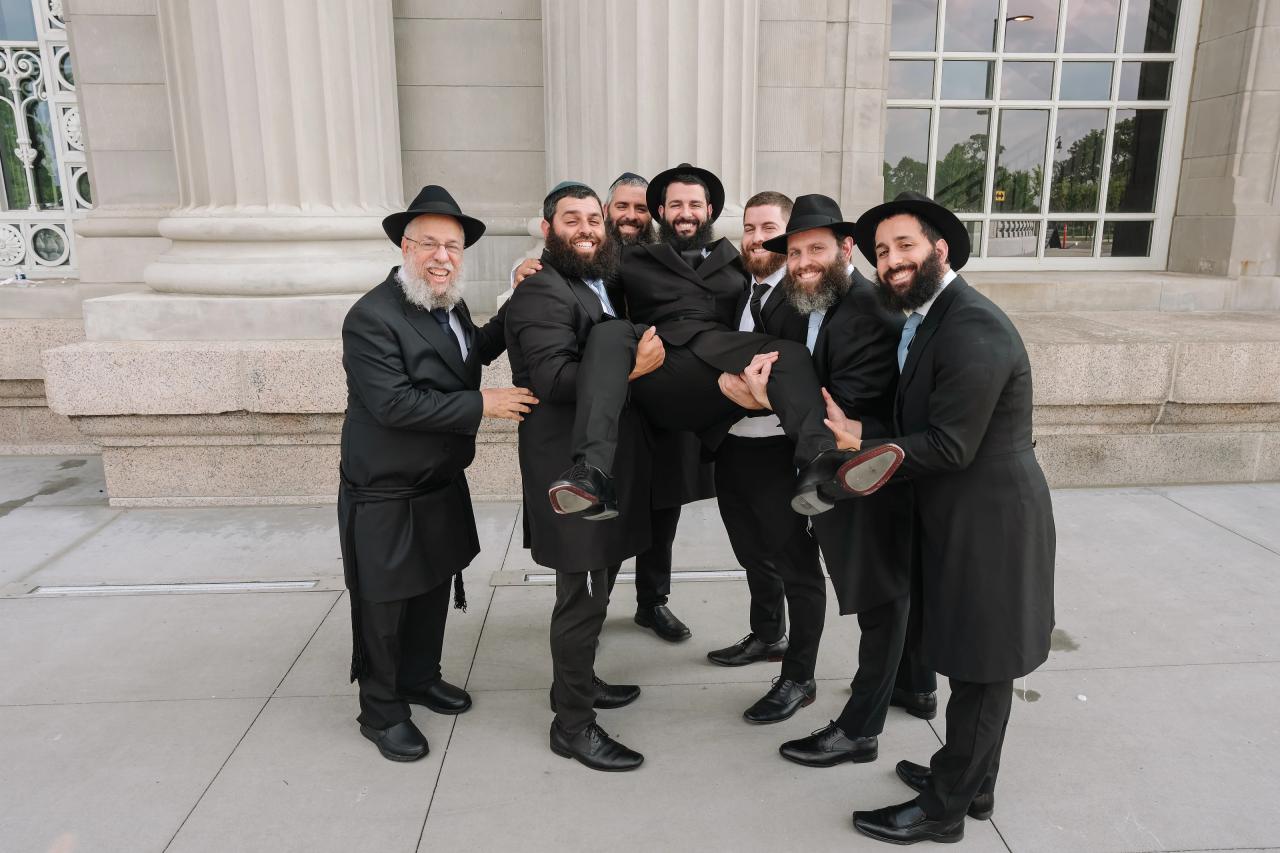Groom and friends celebrating before the ceremony. Jewish wedding in Detroit.