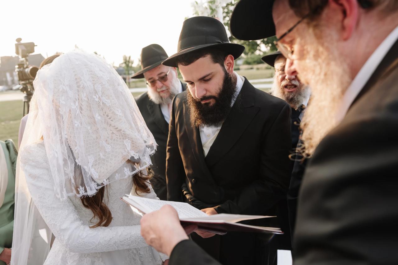 Bride and groom together during the chuppah ceremony. Jewish wedding in Detroit.