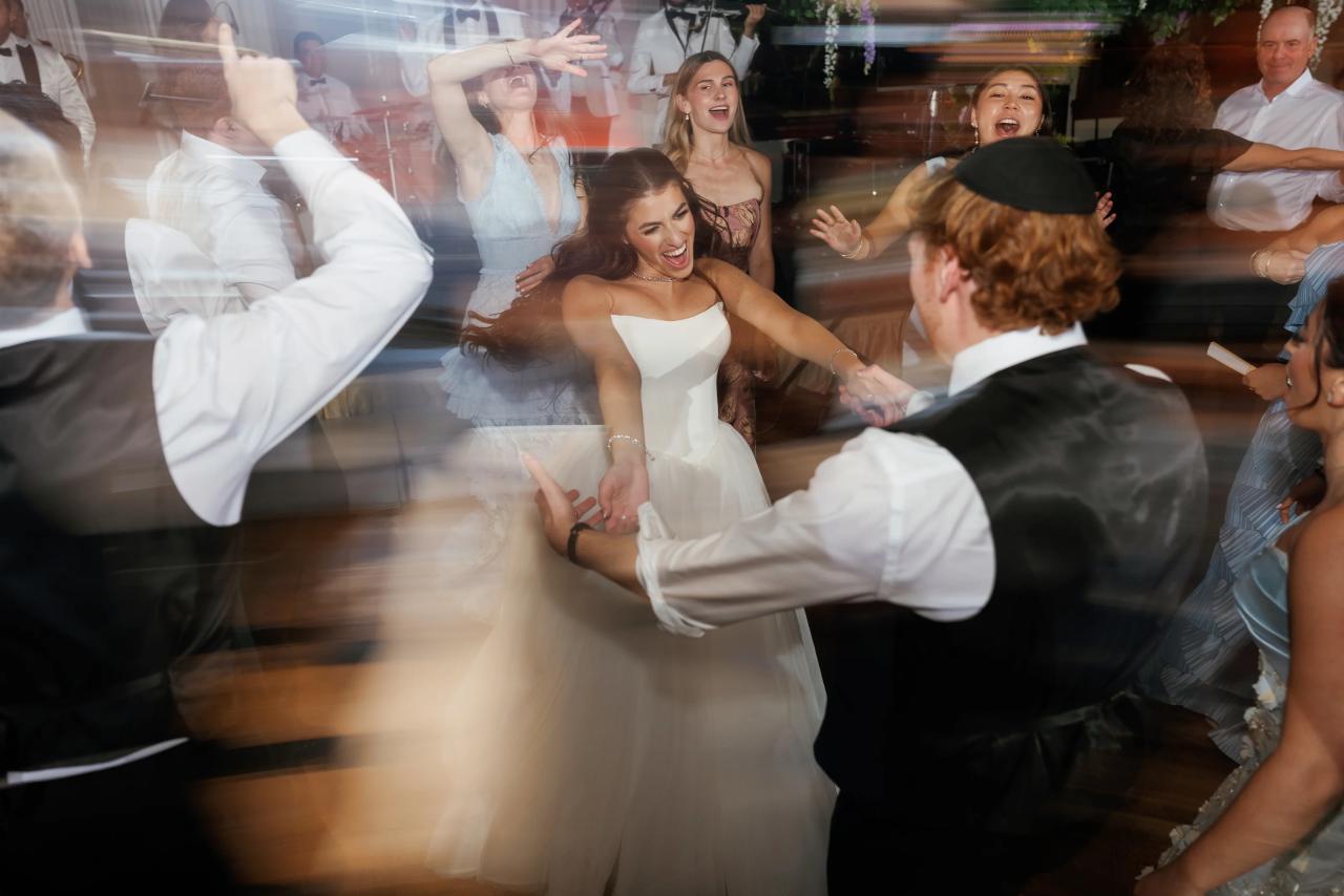 Creative motion-blur photograph of the wedding celebration. Crest Hollow wedding in Woodbury, Long Island.