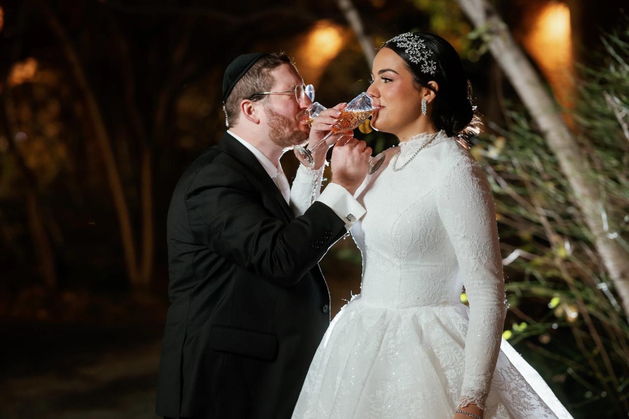 Bride and groom sharing a toast after their portrait session. Wedding portraits in Brooklyn, NYC.