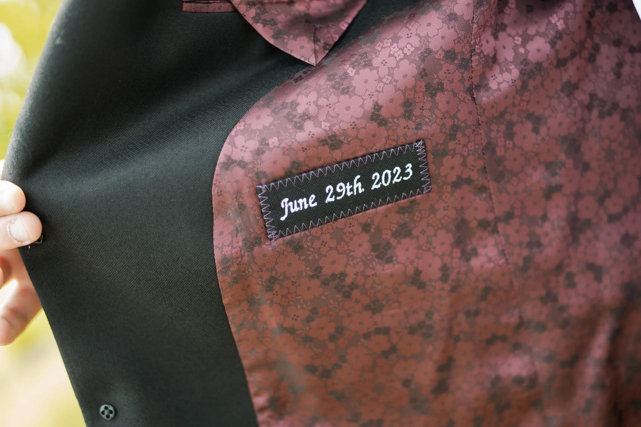 Personal wedding-date detail inside the groom’s jacket. Wedding at Indian Ridge.