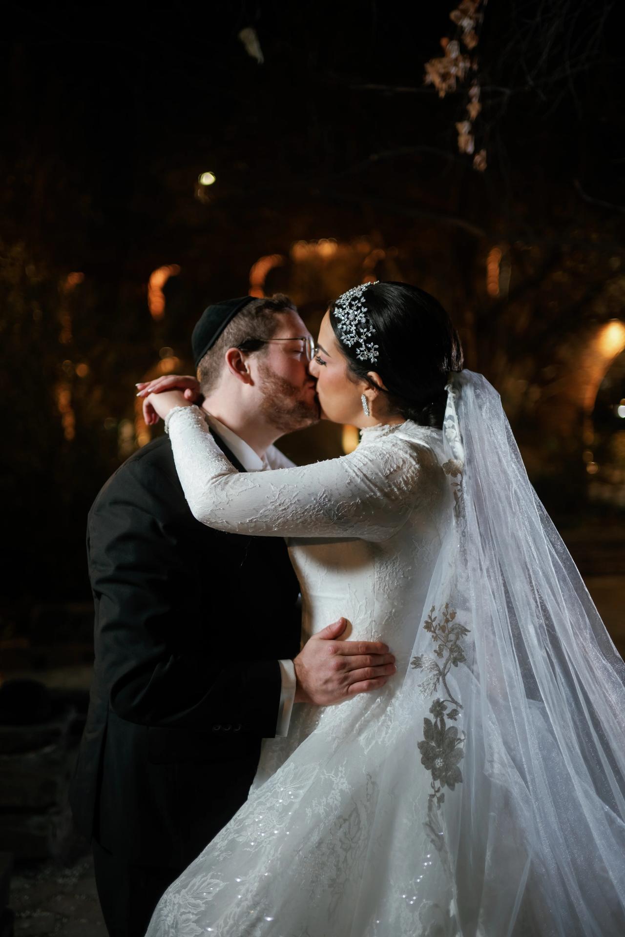 Close wedding portrait beneath the trees after dark. Wedding portraits in Brooklyn, NYC.