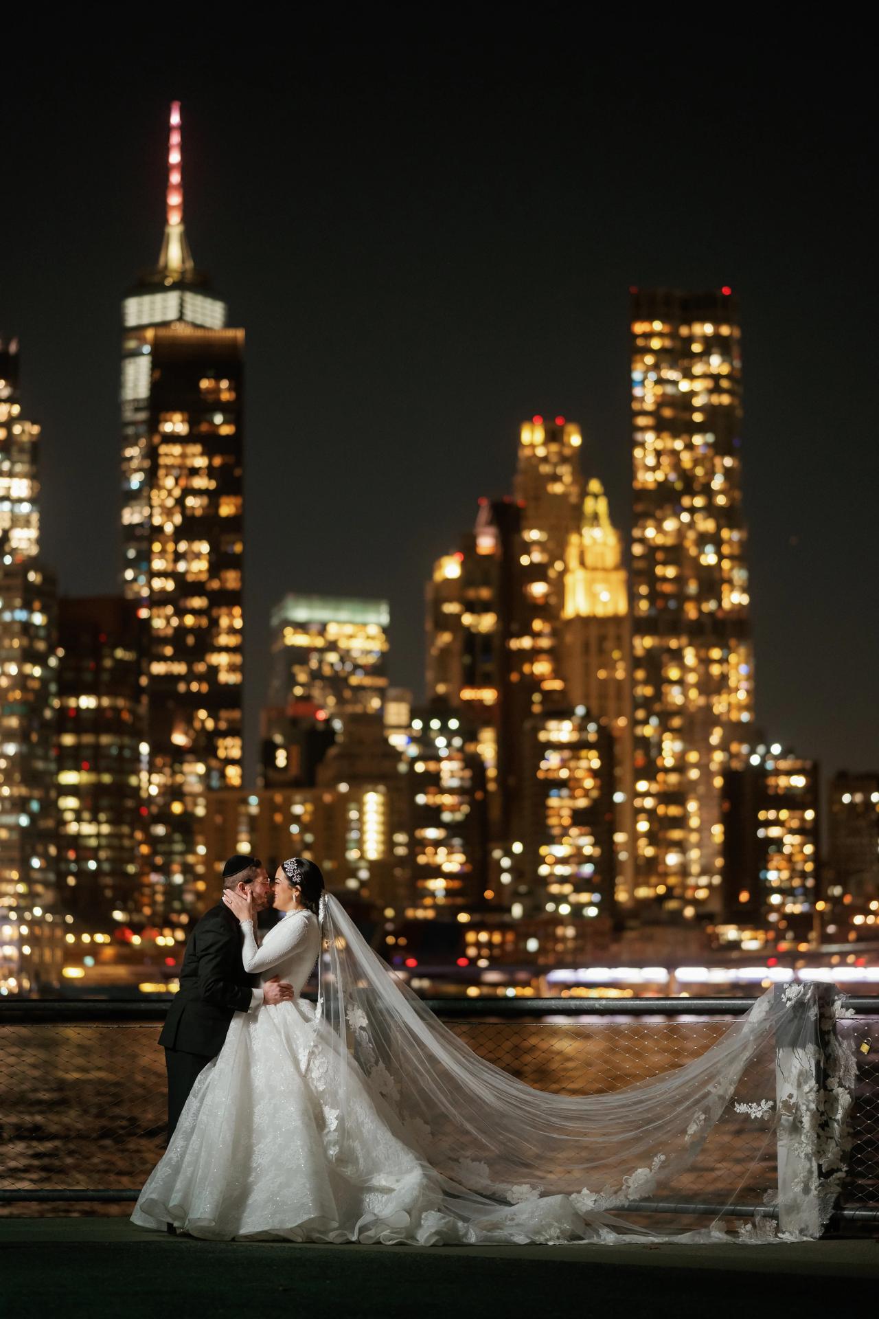 Vertical wedding portrait with One World Trade Center in the background. Wedding portraits in Brooklyn, NYC.