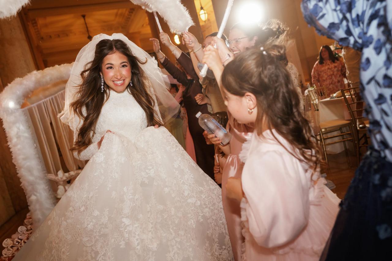 Bride arriving on the reception dance floor. Jewish wedding in Detroit.