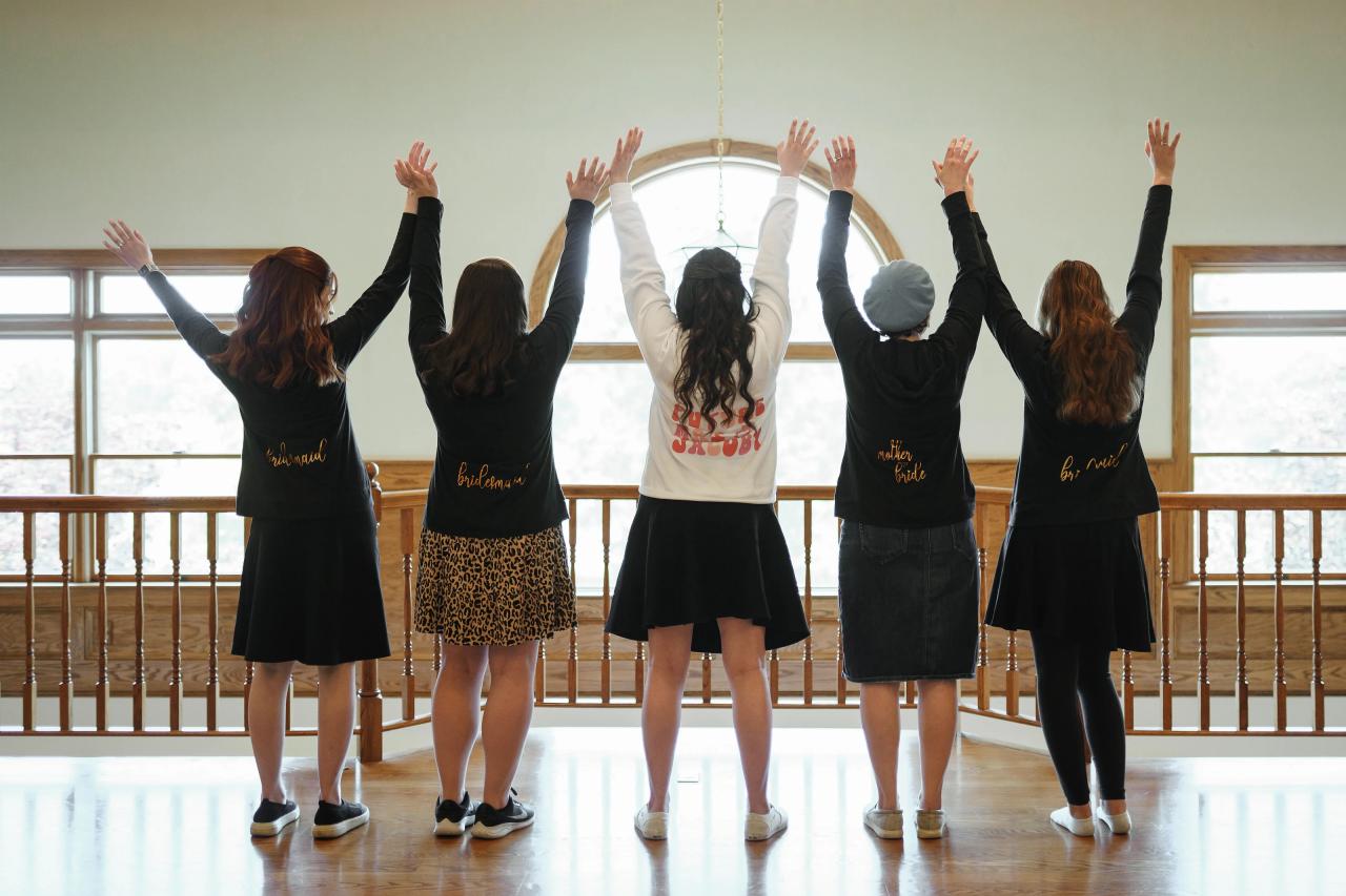 Bride celebrating with her wedding party while getting ready. Jewish wedding in Baltimore.