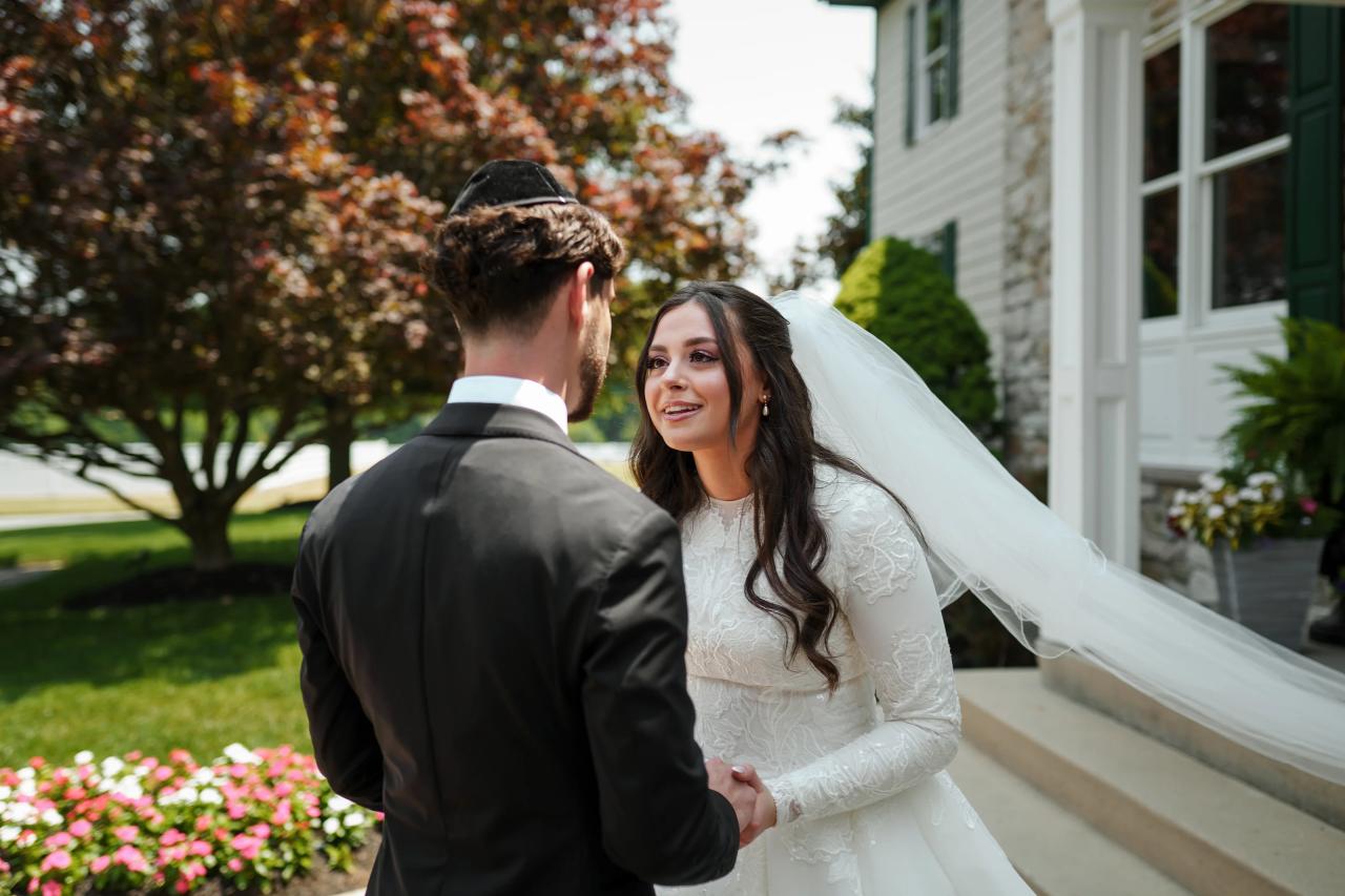 Bride and groom smiling during their first look. Jewish wedding in Baltimore.
