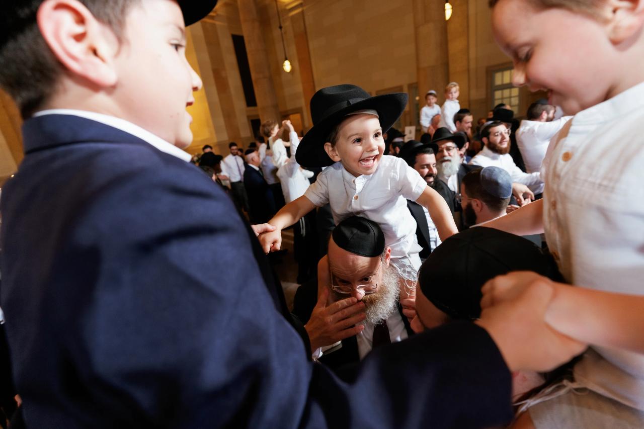 Young guest enjoying the wedding dance floor. Jewish wedding in Detroit.