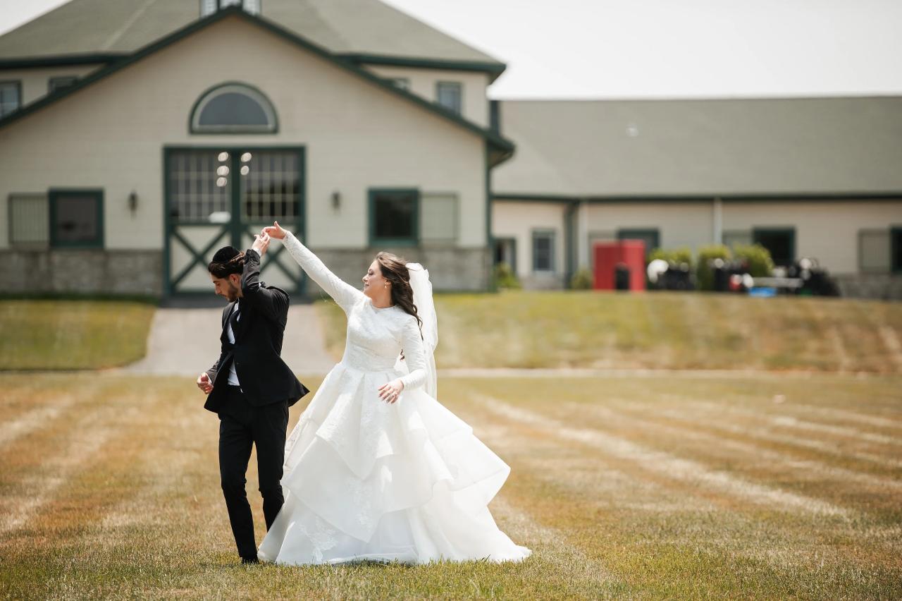 Bride twirling with the groom on the wedding day. Jewish wedding in Baltimore.
