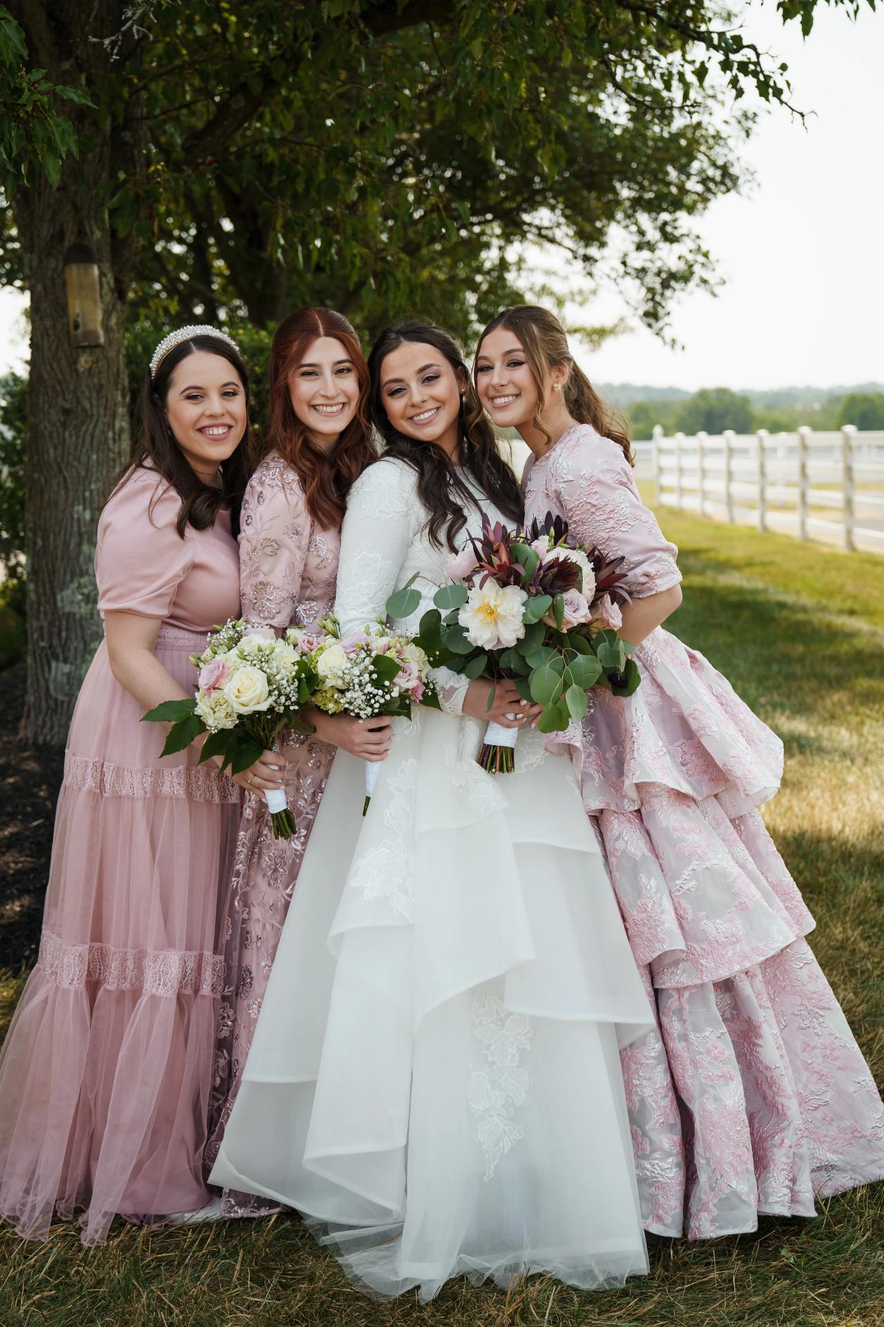 Bride with her bridesmaids in pink dresses. Jewish wedding in Baltimore.
