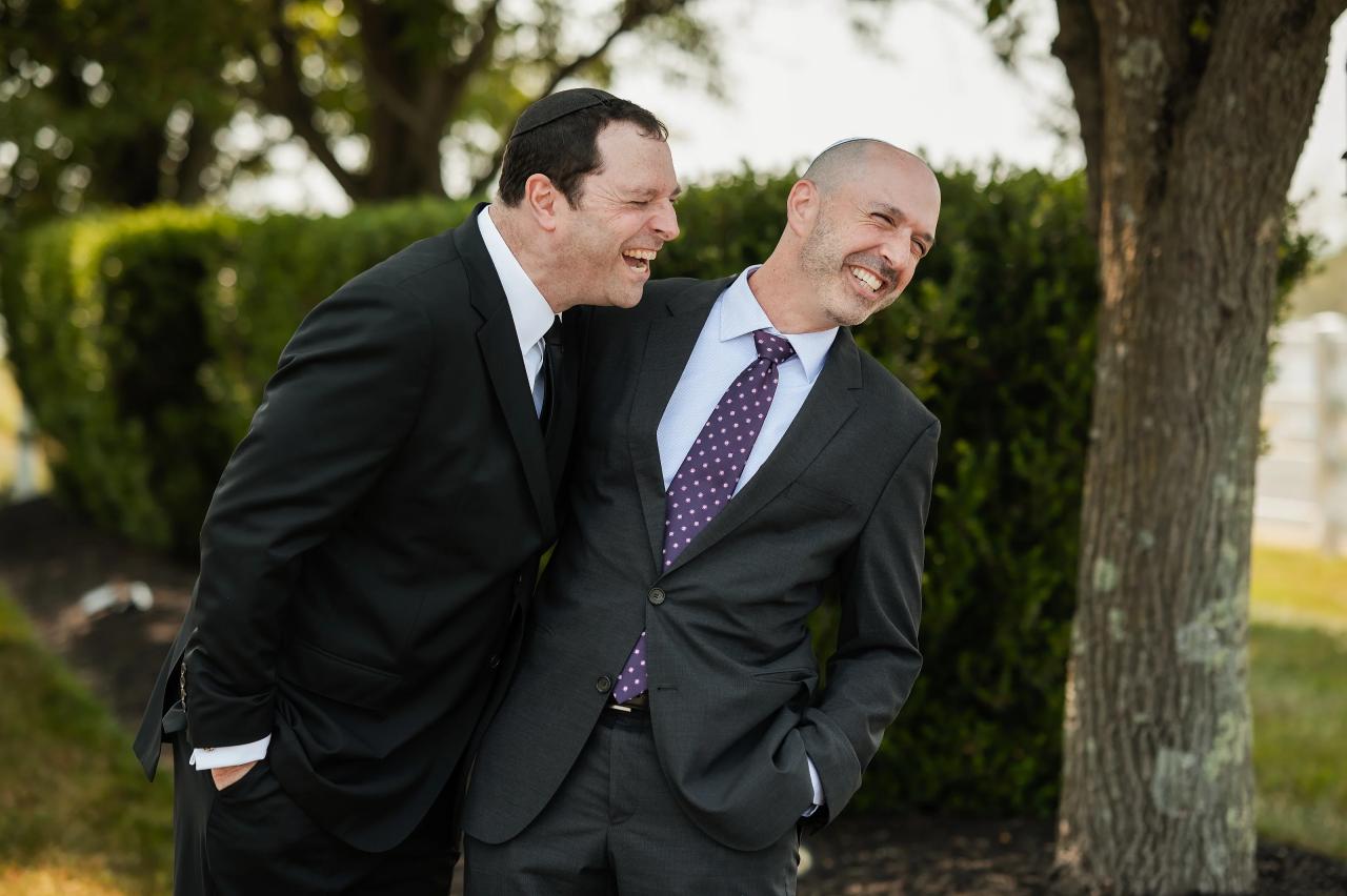 Groom kissing his father on the head. Jewish wedding in Baltimore.