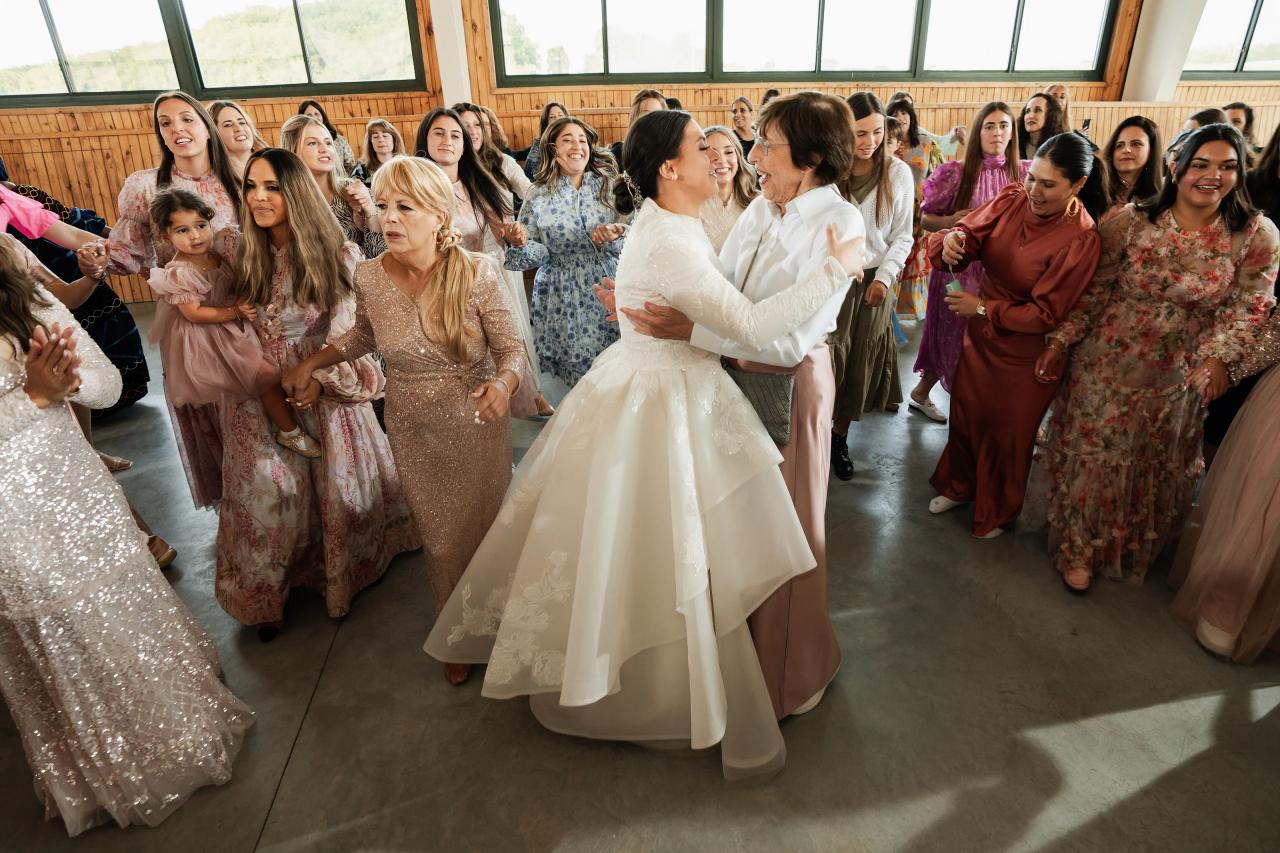 Bride dancing with family and friends at the reception. Jewish wedding in Baltimore.