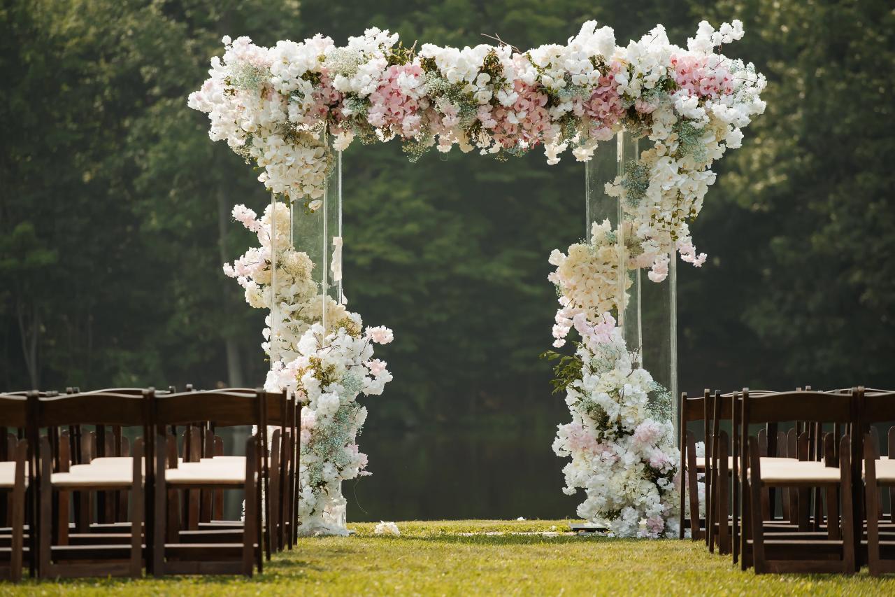 Flower-covered lakeside chuppah at Indian Ridge