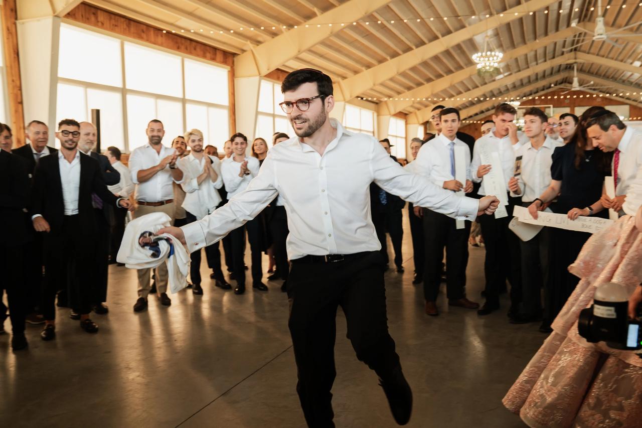 Groom dancing with friends at the wedding reception. Jewish wedding in Baltimore.