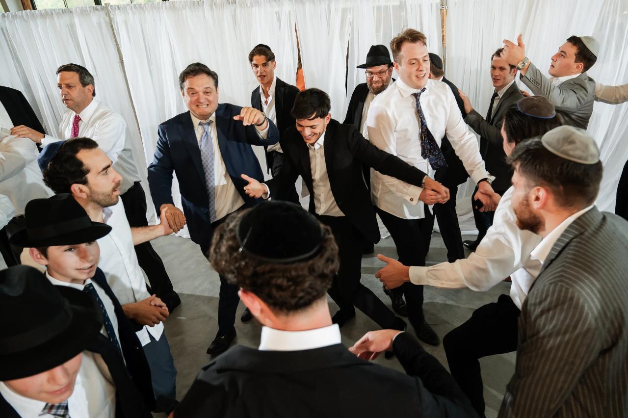 Groom lifted on a chair during the hora. Jewish wedding in Baltimore.