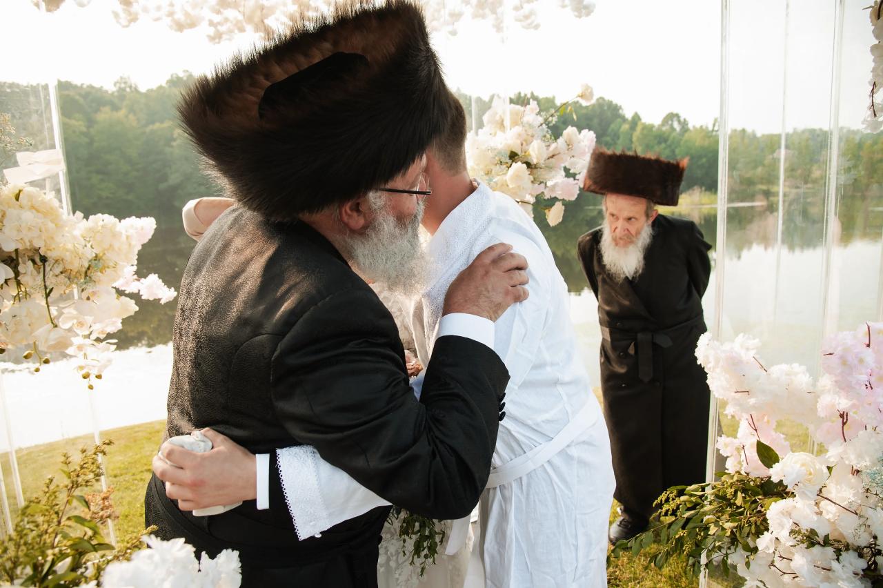 Family embracing after the wedding ceremony. Wedding at Indian Ridge.