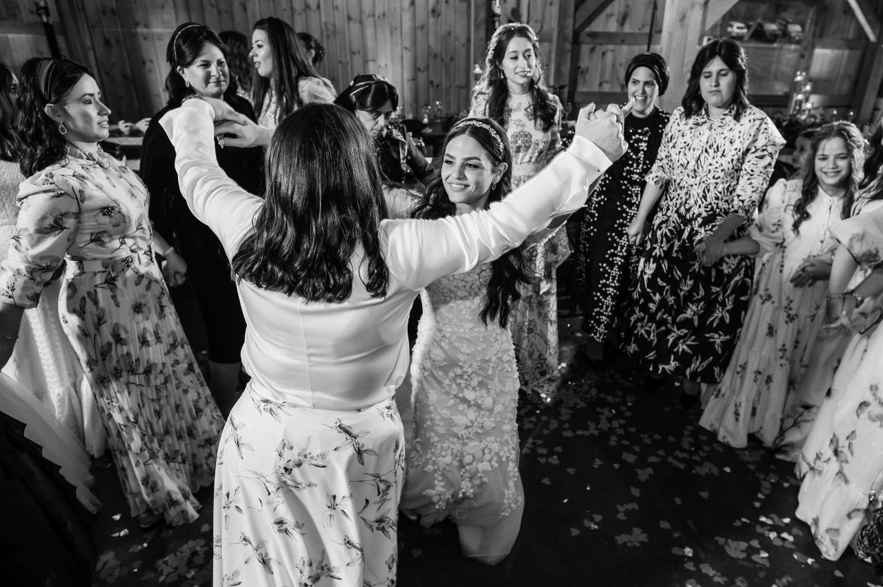 Black-and-white wedding dance floor celebration. Wedding at Indian Ridge.