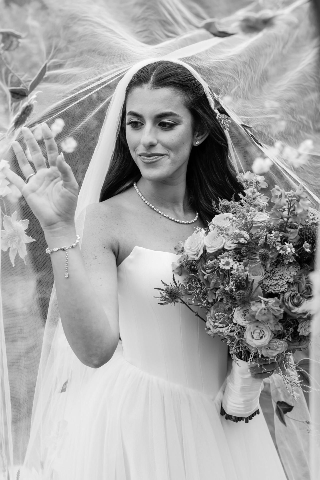 Black-and-white bridal portrait beneath a translucent embroidered veil at Crest Hollow, Woodbury, Long Island.