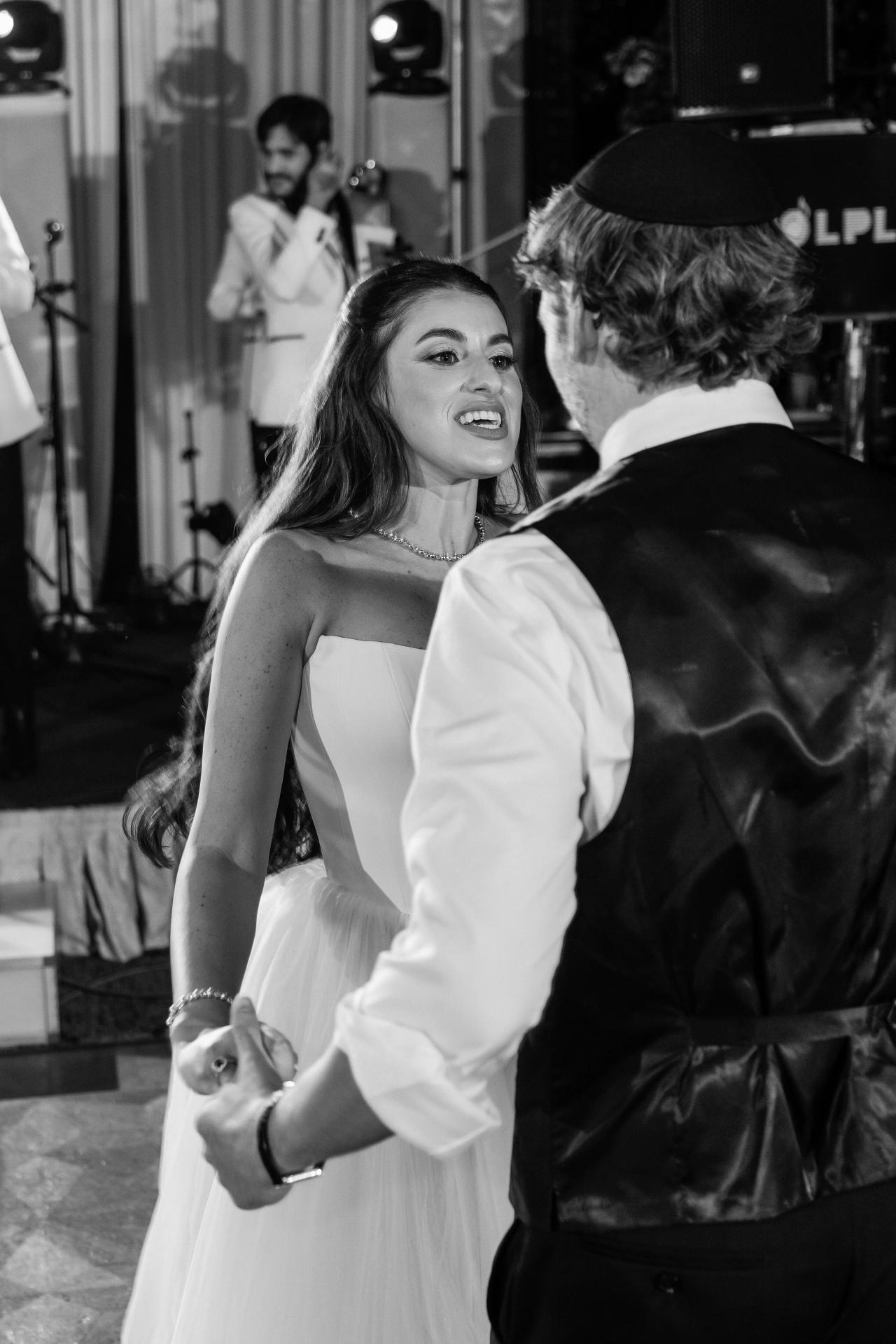 Black-and-white bride looking up at the groom during an intimate reception dance at Crest Hollow, Woodbury, Long Island.