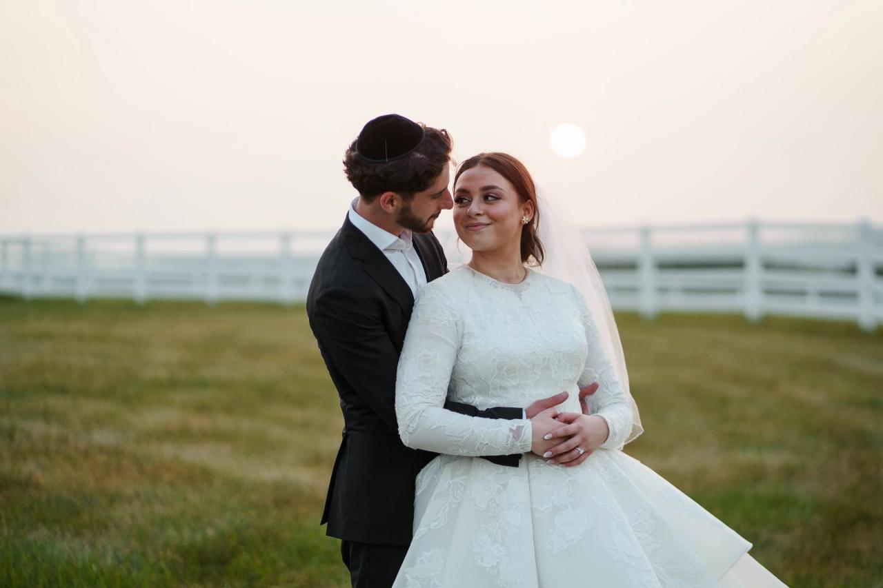 Groom leaning close to the smiling bride with the setting sun behind them at their Baltimore wedding. Wedding photography at Vignon Manor Farm, Baltimore, MD.