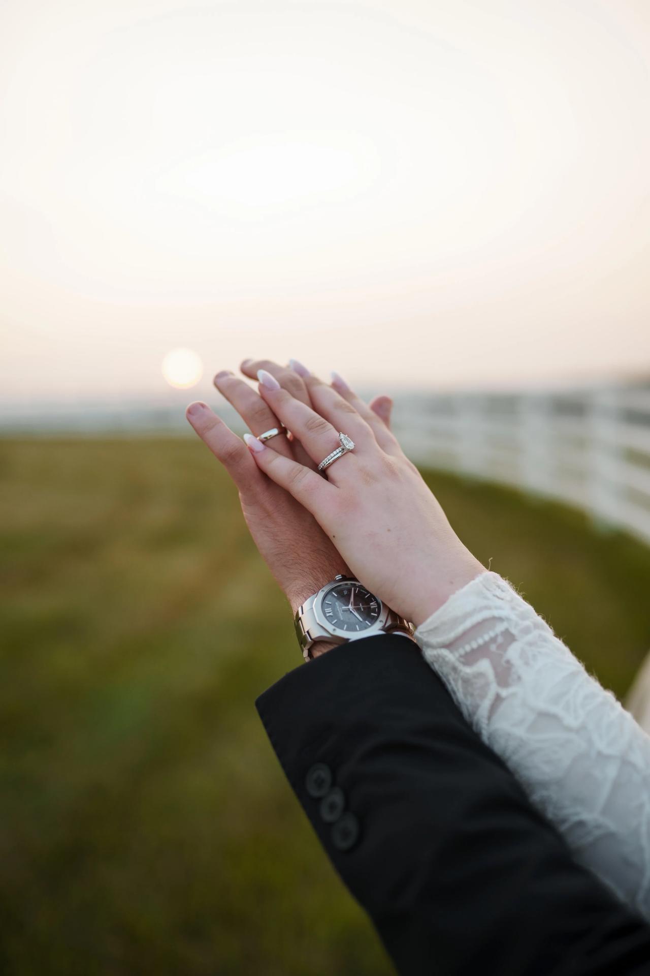 Bride and groom showing their wedding rings against soft sunset light at a Baltimore Jewish wedding. Wedding photography at Vignon Manor Farm, Baltimore, MD.