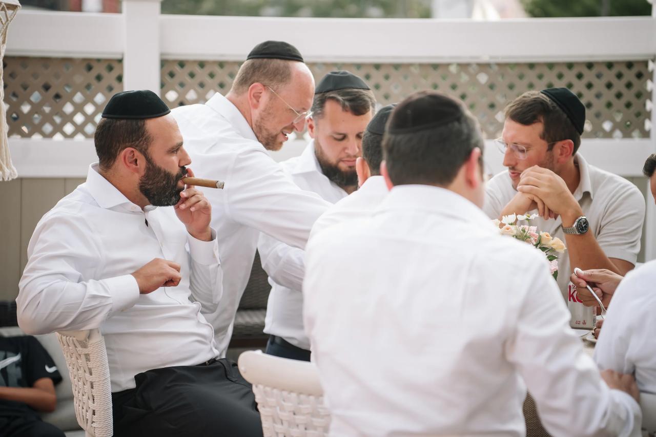 Guests gather closely for an expressive, celebratory moment during the bar mitzvah reception. Bar Mitzvah photography at Hilton Garden Inn Springfield, Springfield, NJ.