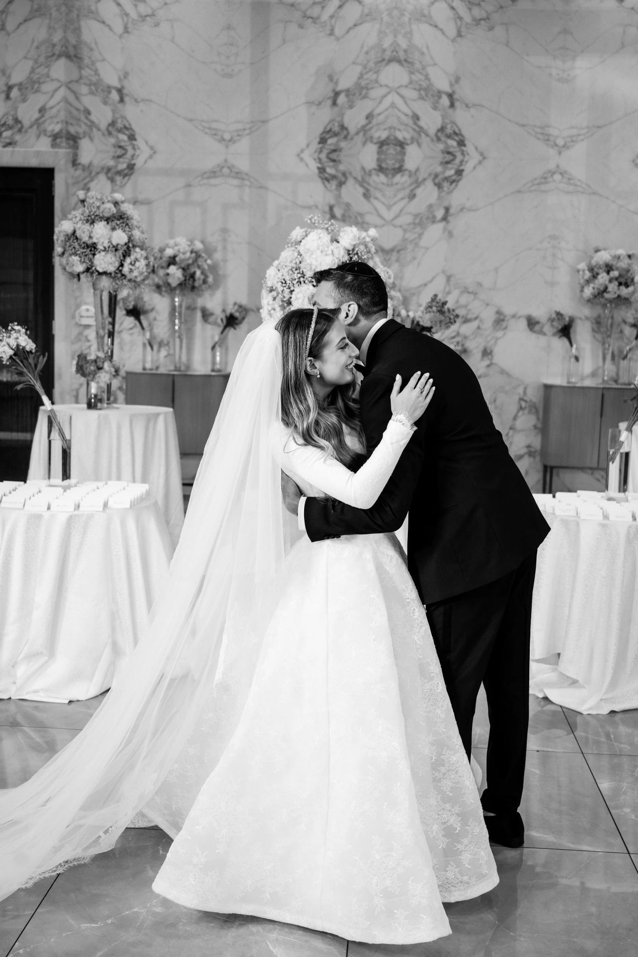 Quiet black-and-white portrait of the couple leaning their heads together. Wedding photography at Brightstone, Passaic, NJ.
