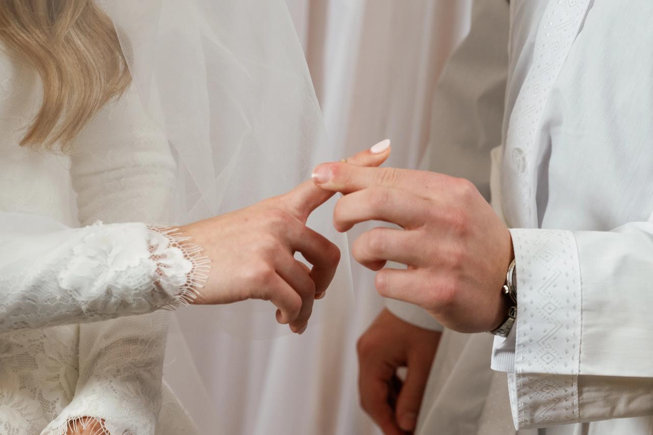 Close-up of hands during the wedding-ring exchange. Wedding photography at Brightstone, Passaic, NJ.