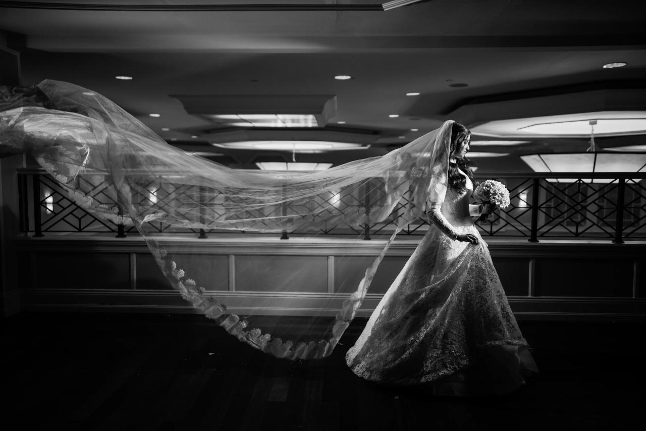 Black-and-white sweeping veil across balcony. Wedding photography at The Palace, Brooklyn, NY.