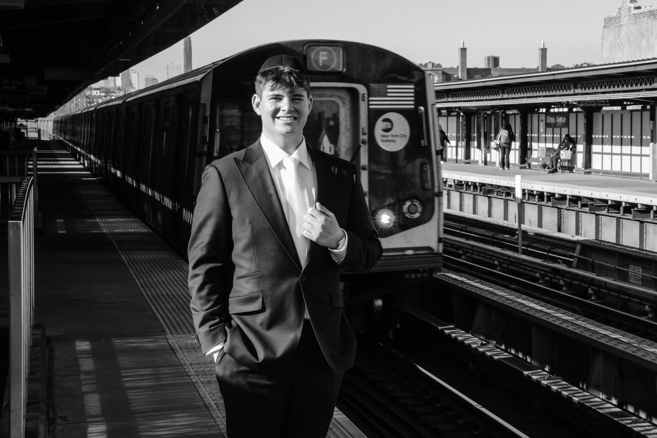 Black-and-white Brooklyn elevated subway portrait, from The Palace wedding’s Brooklyn portrait collection. Wedding photography.