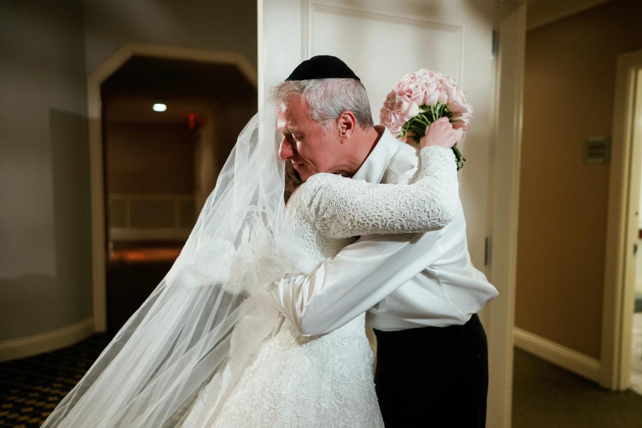 Emotional embrace during preparations. Wedding photography at The Palace, Brooklyn, NY.
