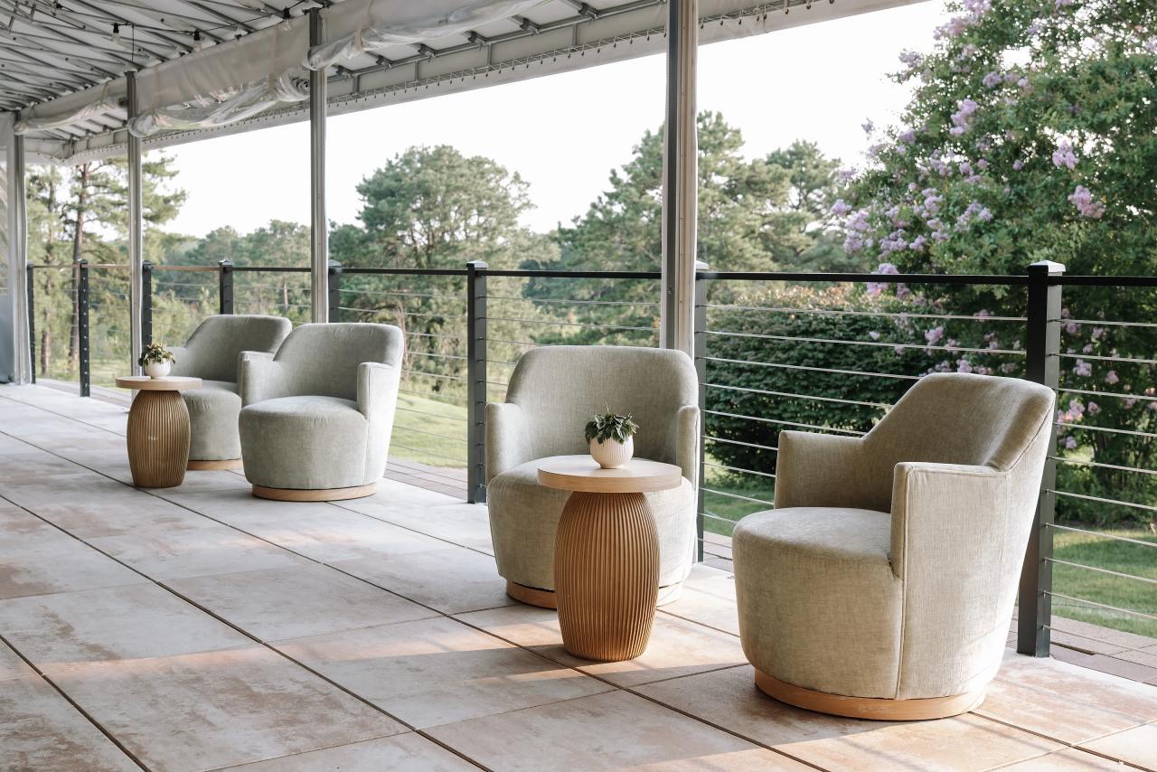 Outdoor terrace seating surrounded by trees. Bar Mitzvah photography at Eagle Ridge, Lakewood, NJ.