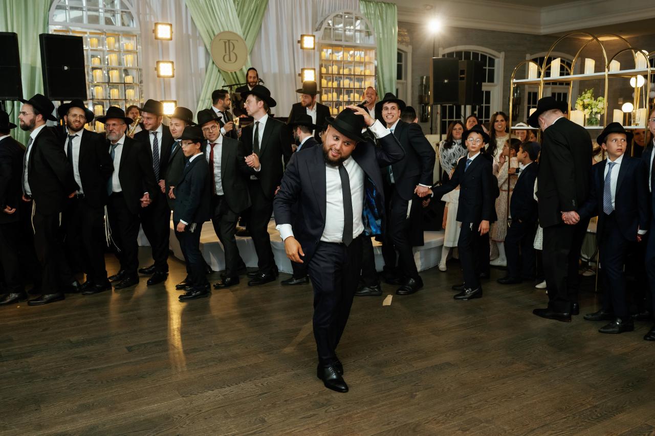 Guests form a wide circle around the dance floor. Bar Mitzvah photography at Eagle Ridge, Lakewood, NJ.