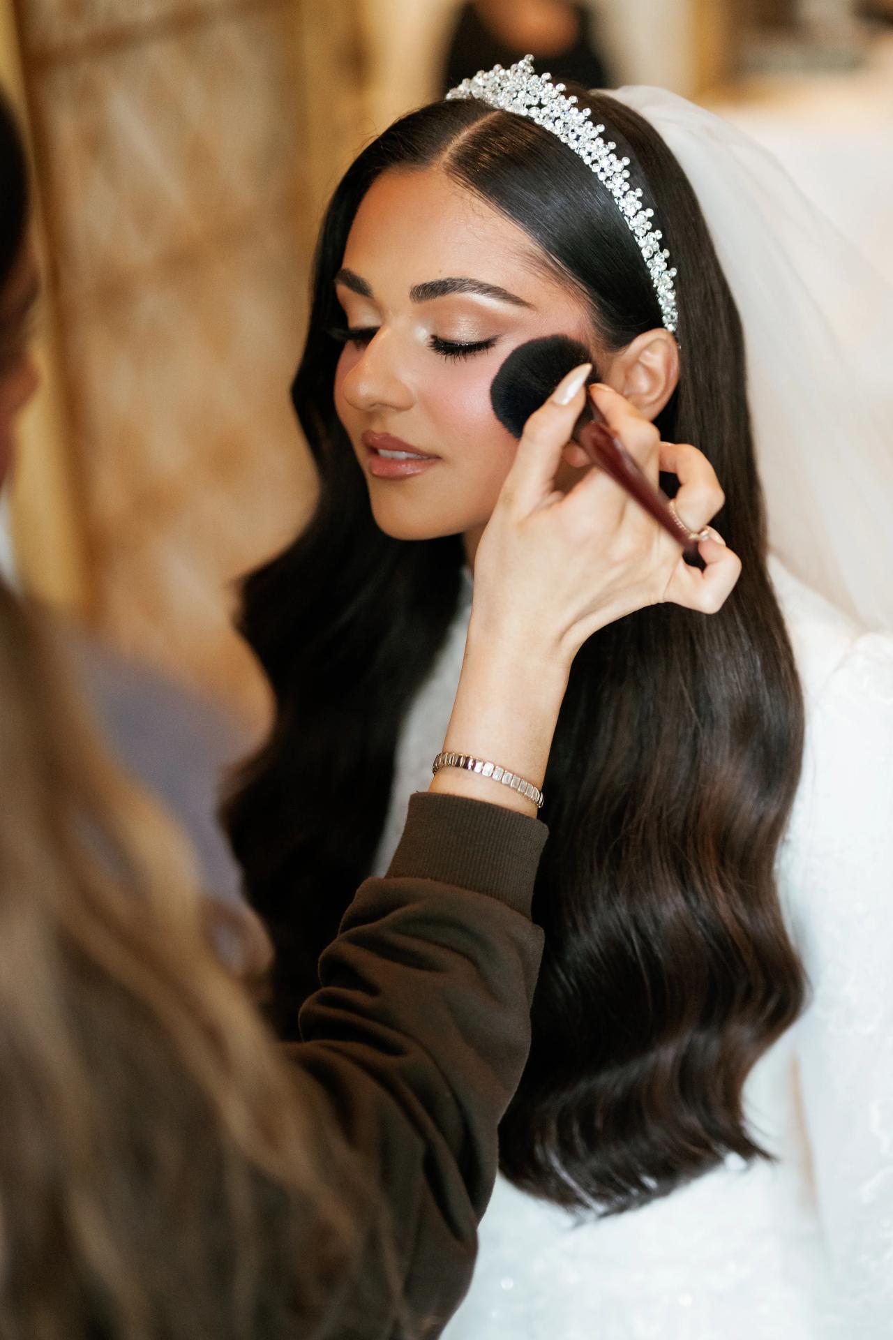 From this Brightstone Hall wedding: a close bridal preparation moment with an earring and makeup. Wedding photography.
