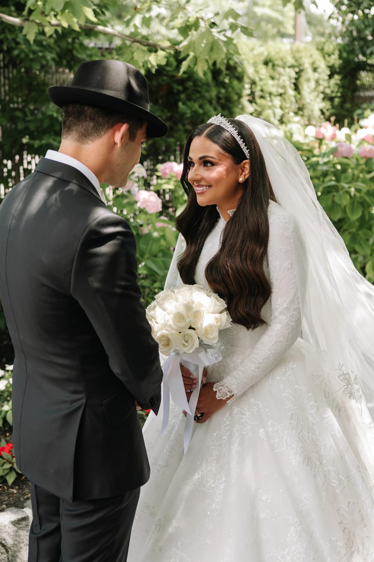 The bride and groom laugh together during their first look. Wedding photography at Brightstone, Passaic, NJ.