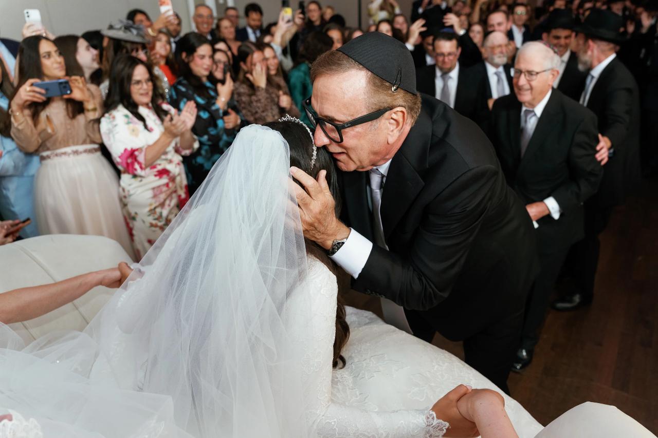A close blessing over the bride before the ceremony. Wedding photography at Brightstone, Passaic, NJ.
