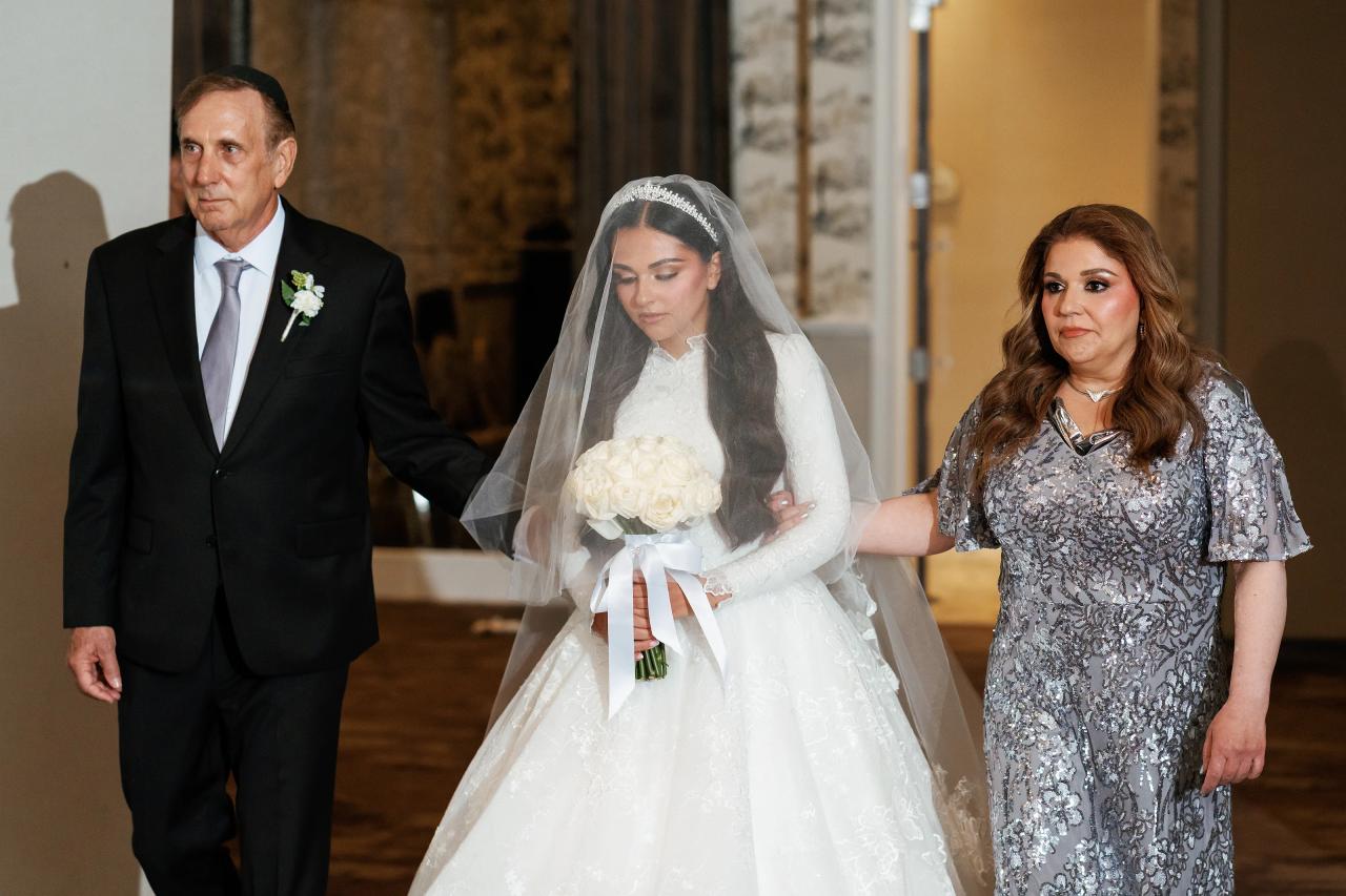 A reflective close portrait of the bride beneath her veil. Wedding photography at Brightstone, Passaic, NJ.