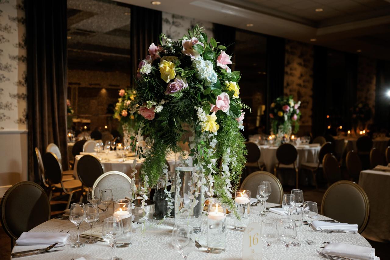 Candlelit flowers on a reception table. Wedding photography at Brightstone, Passaic, NJ.