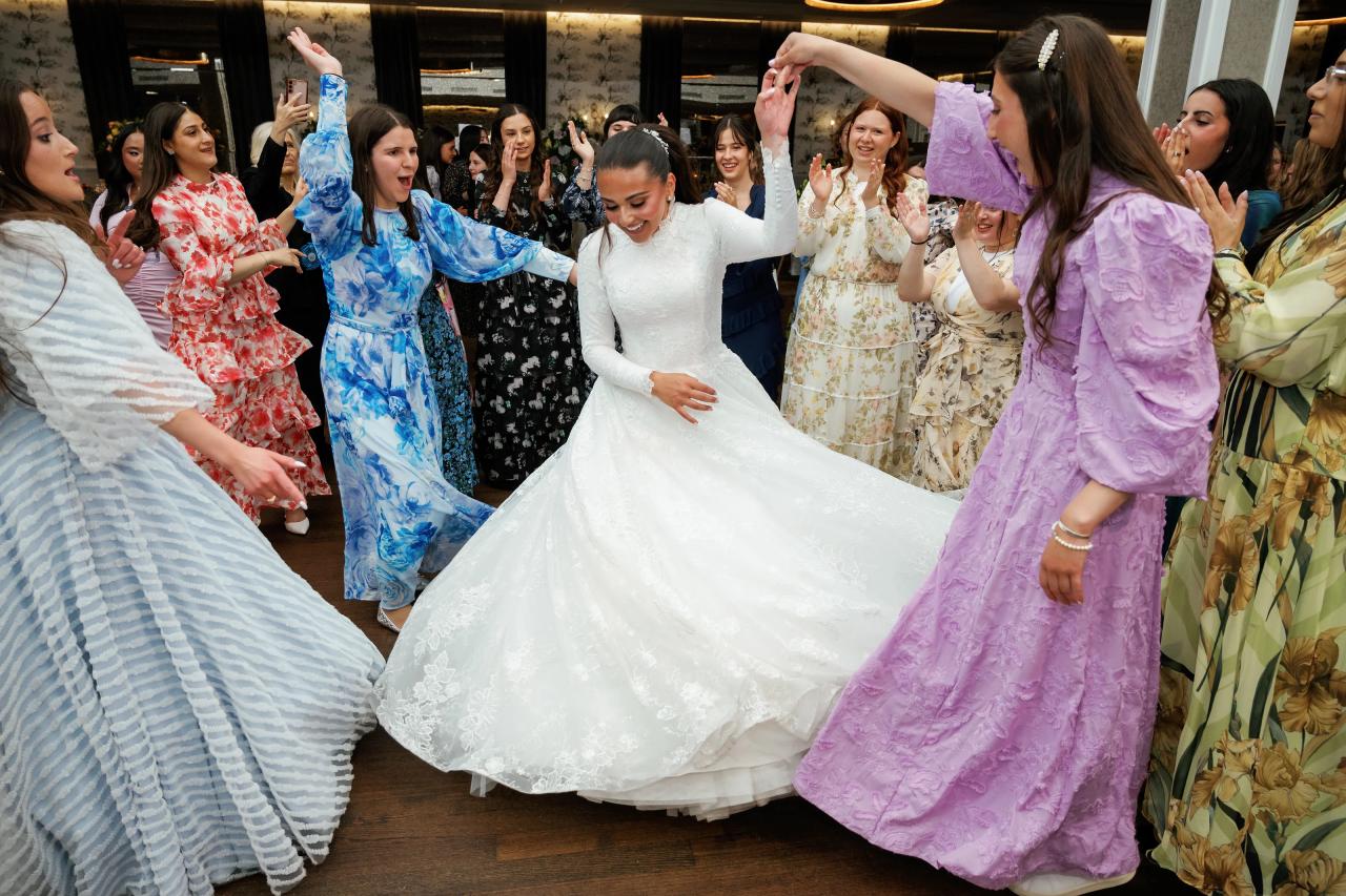 The bride’s wedding gown sweeps across the dance floor. Wedding photography at Brightstone, Passaic, NJ.