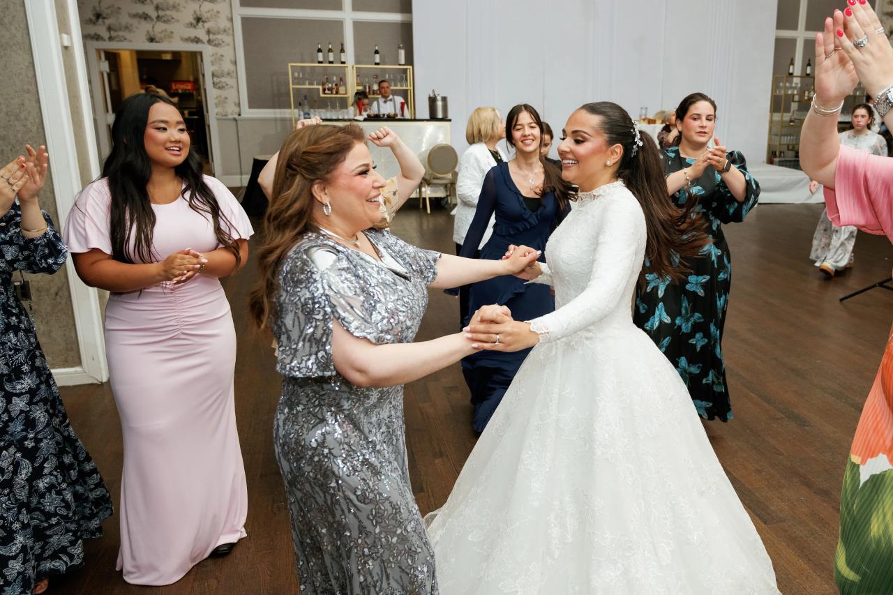 Black-and-white dance-floor movement around the bride’s flowing gown. Wedding photography at Brightstone, Passaic, NJ.
