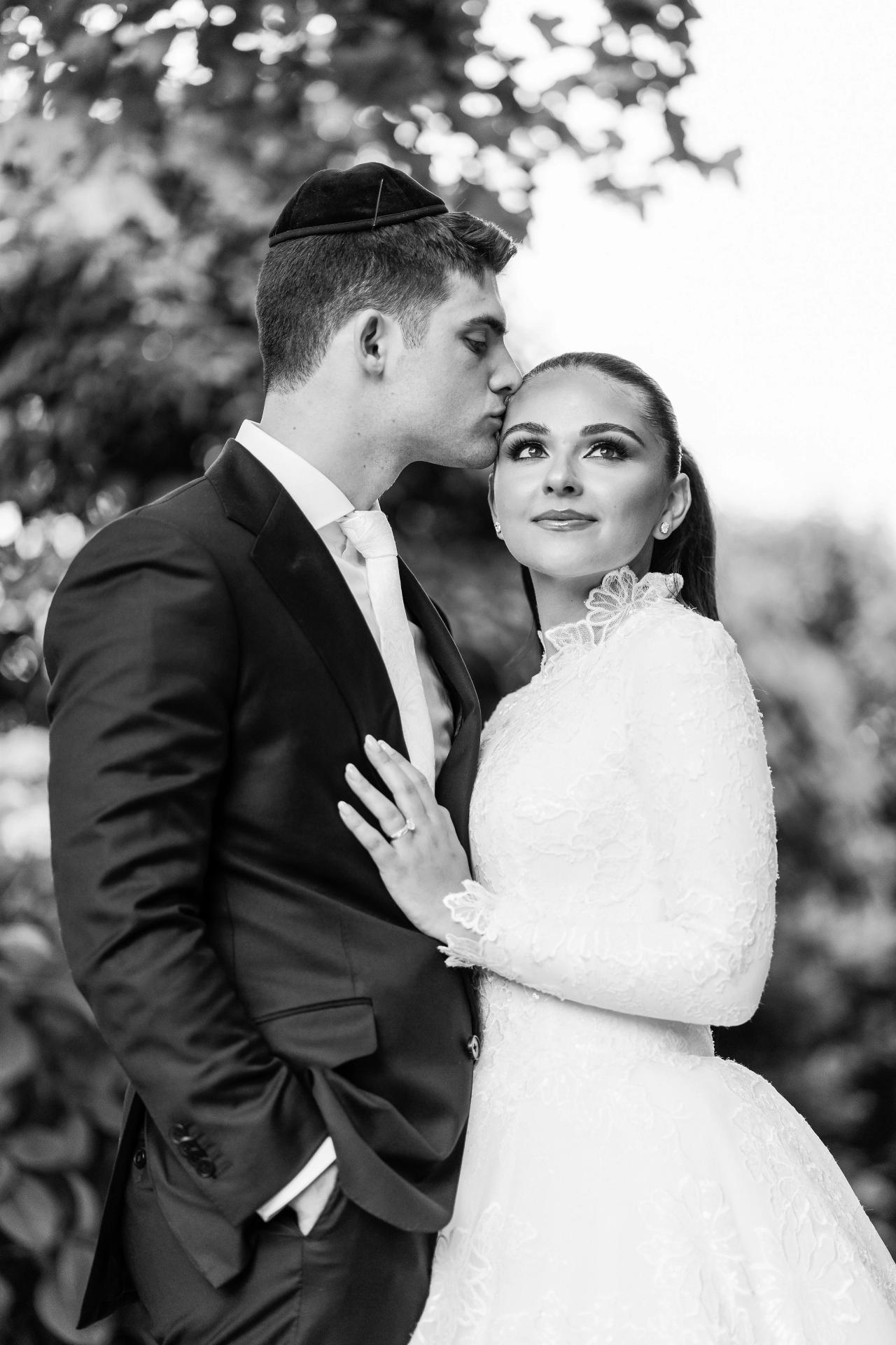 An intimate portrait of the newlyweds among hydrangeas. Wedding photography at Brightstone, Passaic, NJ.